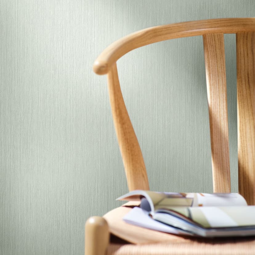 Carta da parati in tessuto non tessuto con linee sottili e texture leggera verde tinta unita